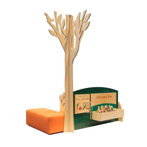 wood learning corner featuring tree, interactive literacy panels and orange bench